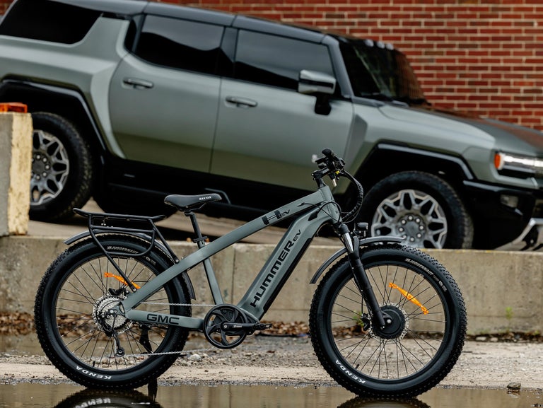 GMC Hummer EV AWD EBike with a GMC Hummer EV in the background